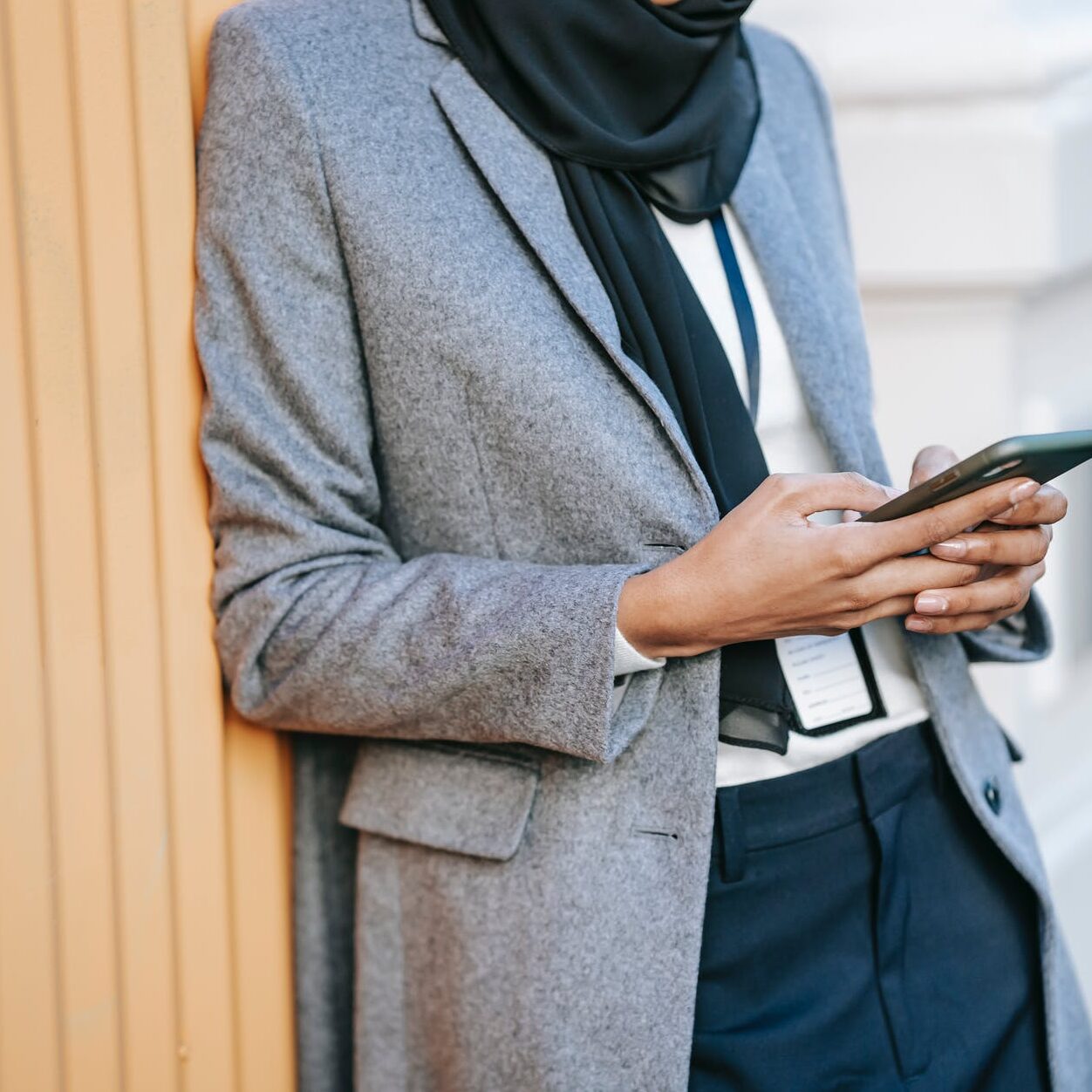 crop stylish lady messaging on smartphone during break